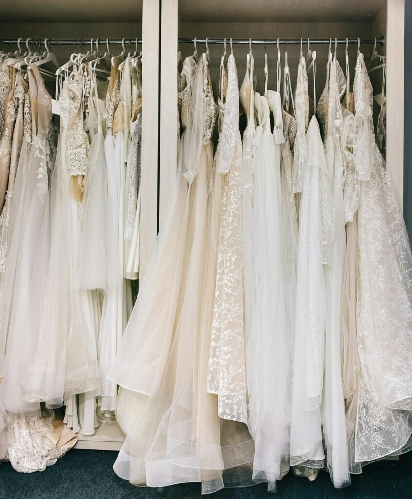 best Designer Clothings in kalyan nagar Collection of bridal gowns elegantly hanging in a boutique in Vilnius, Lithuania.